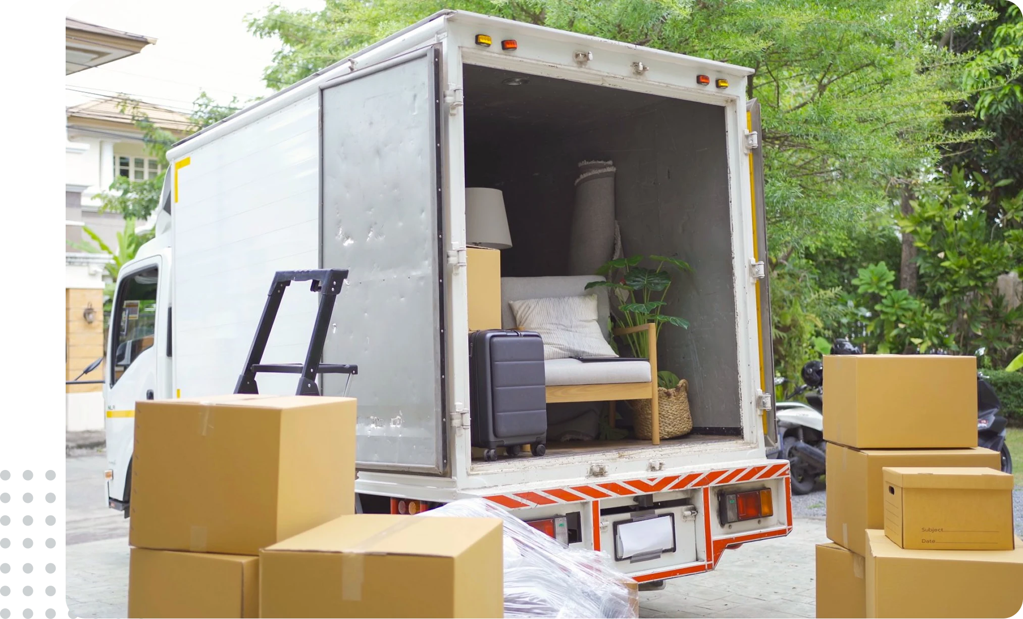 Moving truck loaded with boxes and furniture.